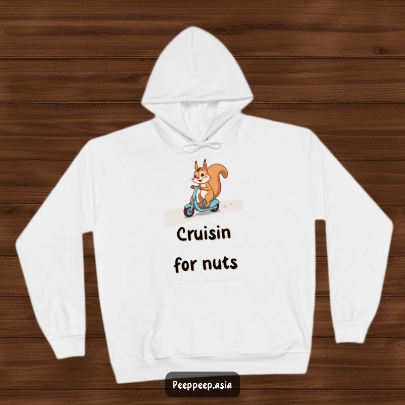 Funny hoodie showcasing a happy squirrel masterfully maneuvering a scooter on a winding road, full of cheerful determination.